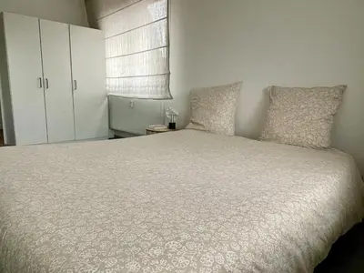 Un ou plusieurs lits dans un hébergement de l'établissement Appartement spacieux et son rooftop
