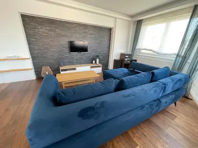 Coin salon dans l'établissement Appartement spacieux et son rooftop