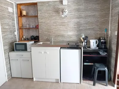 Cuisine ou kitchenette dans l'établissement chambre studio