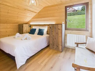 Un ou plusieurs lits dans un hébergement de l'établissement Chalet METCY 12 pers, Jacuzzi, 8km Gerardmer