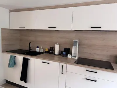 Cuisine ou kitchenette dans l'établissement Le Refuge de Louis