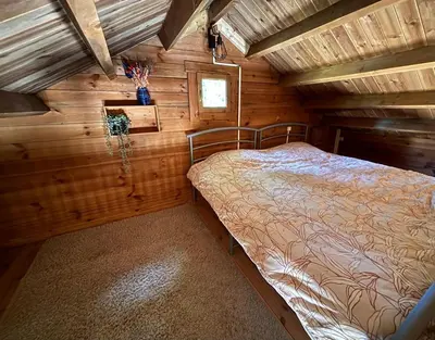 Un ou plusieurs lits dans un hébergement de l'établissement Cabane domaine du morbues
