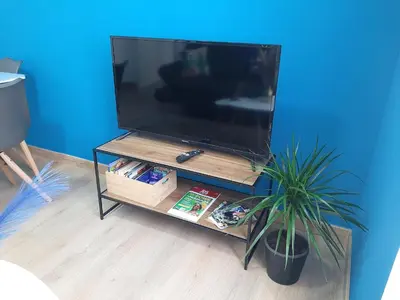 Télévision ou salle de divertissement dans l'établissement L'Échappée douce - Central, paisible et lumineux