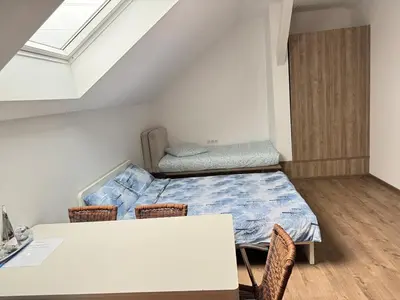 Un ou plusieurs lits dans un hébergement de l'établissement New appartement