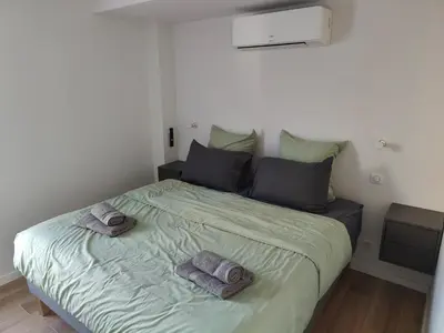 Un ou plusieurs lits dans un hébergement de l'établissement L'Écrin Ludovicien Spa & chambres design aux portes de Bâle