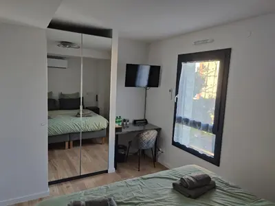 Un ou plusieurs lits dans un hébergement de l'établissement L'Écrin Ludovicien Spa & chambres design aux portes de Bâle