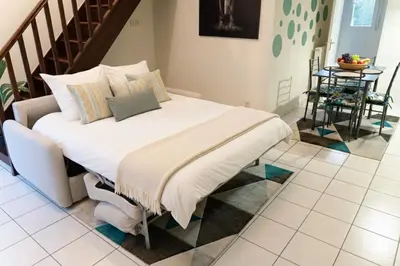 Un ou plusieurs lits dans un hébergement de l'établissement Duplex cosy- proche centre ville