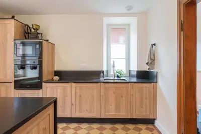 Cuisine ou kitchenette dans l'établissement Gîte de l'Oriel - Gîte avec Grand Jardin