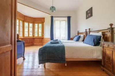 Un ou plusieurs lits dans un hébergement de l'établissement Gîte de l'Oriel - Gîte avec Grand Jardin