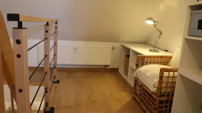 Un ou plusieurs lits dans un hébergement de l'établissement Le duplex des Marchands