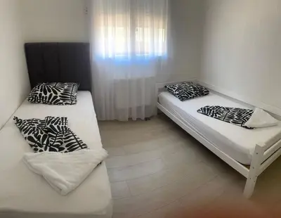 Un ou plusieurs lits dans un hébergement de l'établissement Maison de vacances