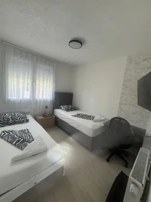 Un ou plusieurs lits dans un hébergement de l'établissement Maison de vacances