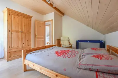 Un ou plusieurs lits dans un hébergement de l'établissement Chalet de la Lunelle