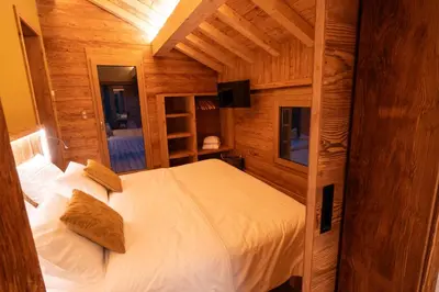Un ou plusieurs lits dans un hébergement de l'établissement Le Chalet Vosges Alsace - La Petite Ferme 4 étoiles