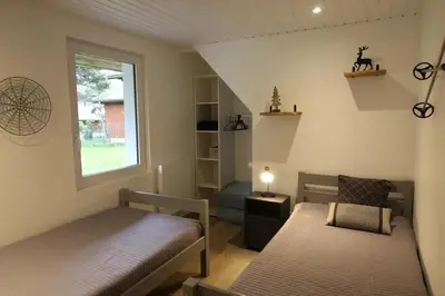 Un ou plusieurs lits dans un hébergement de l'établissement Chalet 6 personnes au Ménil - Vosges - Vacances nature en famille