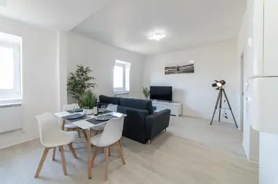 Télévision ou salle de divertissement dans l'établissement Le Sweet Duplex
