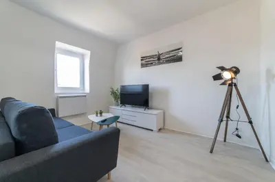 Télévision ou salle de divertissement dans l'établissement Le Sweet Duplex