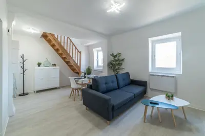 Coin salon dans l'établissement Le Sweet Duplex