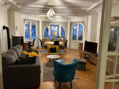 Télévision ou salle de divertissement dans l'établissement Séjour entre ville et montagnes Appartement 90 m2