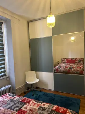 Un ou plusieurs lits dans un hébergement de l'établissement Séjour entre ville et montagnes Appartement 90 m2