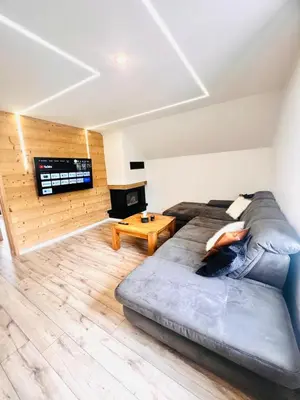 Coin salon dans l'établissement Duplex cosy proche Gérardmer