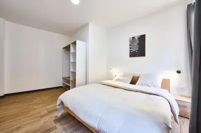 Un ou plusieurs lits dans un hébergement de l'établissement TH 101 Appartement F3 spacieux 1 à 5 pers 1er étage
