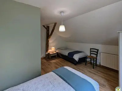 Un ou plusieurs lits dans un hébergement de l'établissement Gîte spacieux au cœur des Vosges du Sud avec jardin et parking sécurisés - FR-1-583-462
