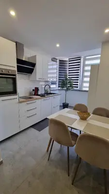 Cuisine ou kitchenette dans l'établissement La perle du Lion