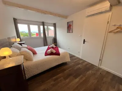 Un ou plusieurs lits dans un hébergement de l'établissement La Cour de Mamama Appartement 5