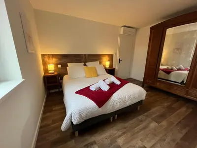 Un ou plusieurs lits dans un hébergement de l'établissement La Cour de Mamama Appartement 6