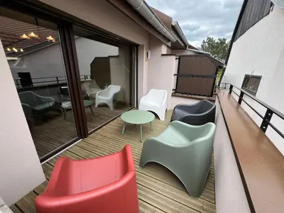 Coin salon dans l'établissement La Cour de Mamama Appartement 6