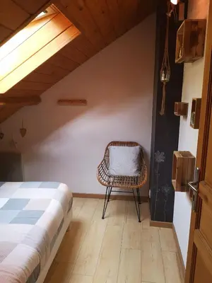 Un ou plusieurs lits dans un hébergement de l'établissement Lodge Les Rêveries de Charles