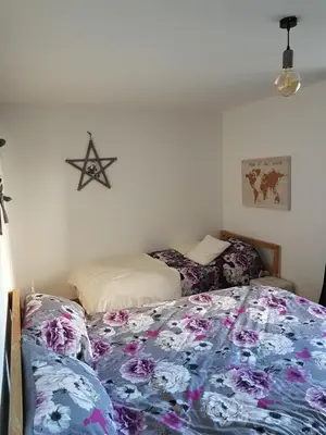 Un ou plusieurs lits dans un hébergement de l'établissement Appartement Melou rez de chaussée