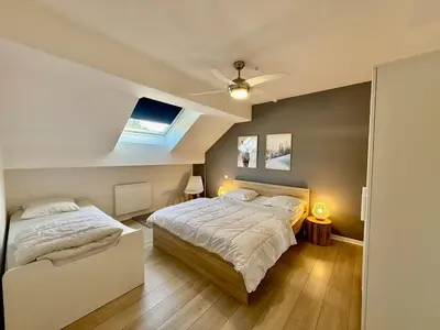Un ou plusieurs lits dans un hébergement de l'établissement L'Appart des Copains, beau duplex & centre-ville