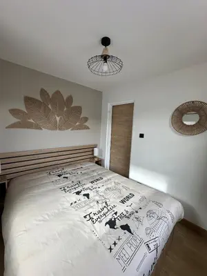 Un ou plusieurs lits dans un hébergement de l'établissement Appartement avec vue lac