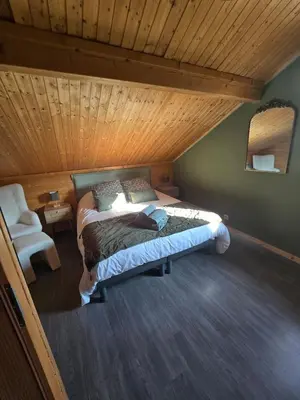 Un ou plusieurs lits dans un hébergement de l'établissement Le Chalet d'AxEllie Spa et Confort
