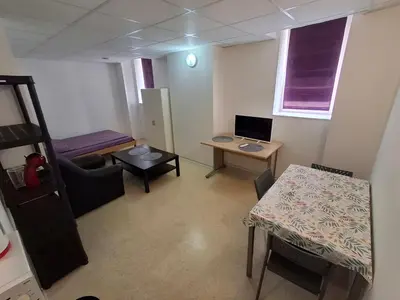 Télévision ou salle de divertissement dans l'établissement Studio meublé Sochaux 309