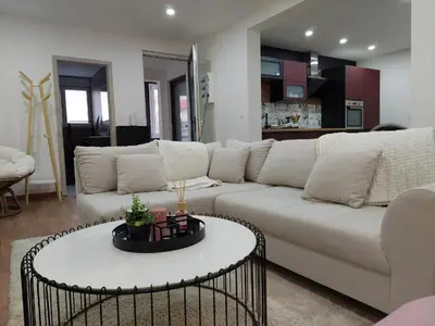 Coin salon dans l'établissement Le Big Bag 5 chambres appartement familial