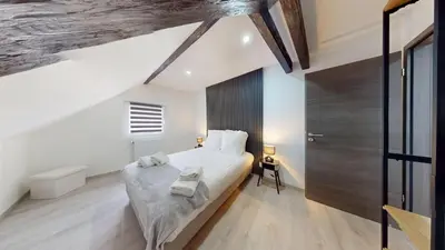 Un ou plusieurs lits dans un hébergement de l'établissement Le Big Bag 5 chambres appartement familial