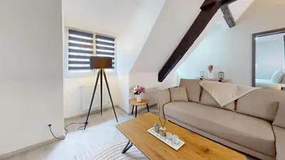 Coin salon dans l'établissement Le Big Bag 5 chambres appartement familial