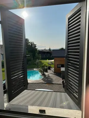 Piscine de l'établissement Chez Seb et Lilou - Villa - piscine partagée - parking - proche Mulhouse ou située à proximité