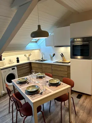 Cuisine ou kitchenette dans l'établissement La Petite Mansarde