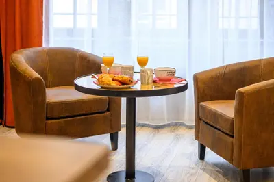 Coin salon dans l'établissement Le 16-Appart'Hôtel-GregIMMO