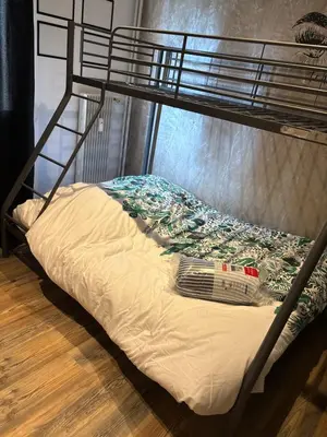 Un ou plusieurs lits dans un hébergement de l'établissement Bel appartement au calme dans copropriété t 3 hauteur Montbéliard
