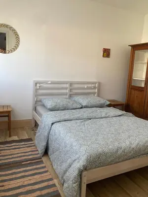 Un ou plusieurs lits dans un hébergement de l'établissement Maison Martin de ville de style 6 pers calme terrasse
