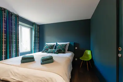 Un ou plusieurs lits dans un hébergement de l'établissement Maison d'Hôtes et Restaurant à Hochstatt