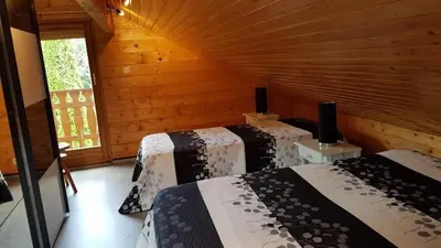 Un ou plusieurs lits dans un hébergement de l'établissement Chalet Les Jonquilles