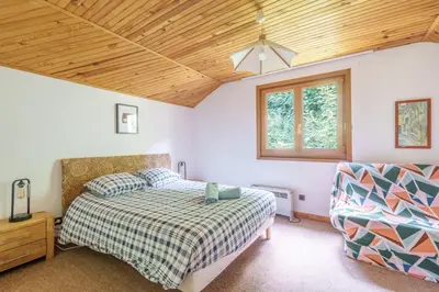 Un ou plusieurs lits dans un hébergement de l'établissement La Bonne Idée - Gîte familial vue montagne