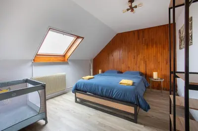Un ou plusieurs lits dans un hébergement de l'établissement ESPLANADE Maison spa jeux cinéma Colmar