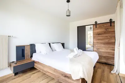 Un ou plusieurs lits dans un hébergement de l'établissement Suite Dreams - Balnéo & Sauna